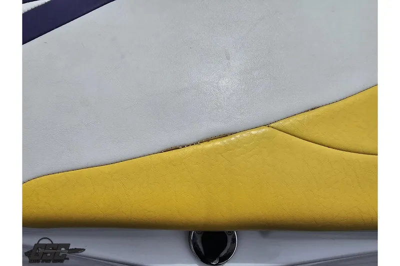 Slide: The Image of Yellow and white upholstery detail on a 2005 Baja 30 Outlaw boat. - 40