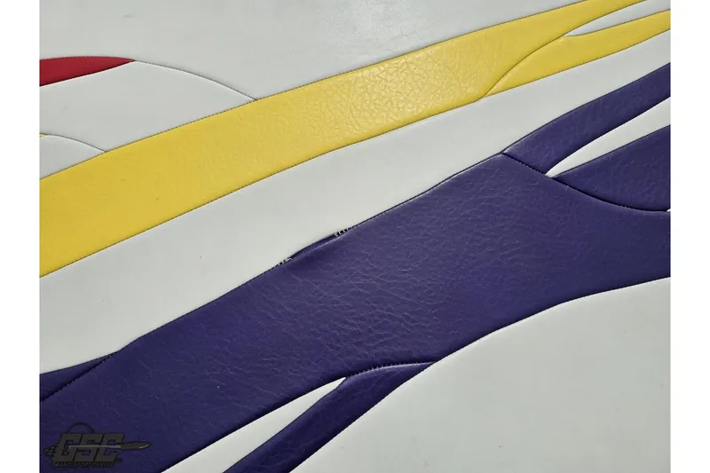 Slide: The Image of Colorful leather upholstery design on a 2005 Baja 30 Outlaw boat interior. - 41