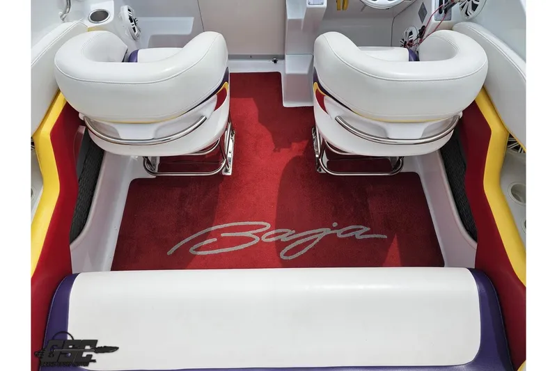 Slide: The Image of 2005 Baja 30 Outlaw boat interior with white seats and red carpet. - 45