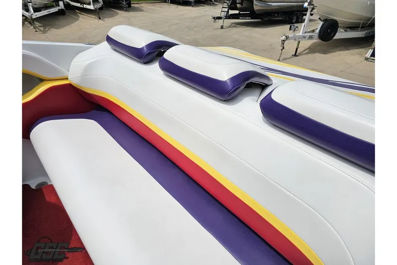 Slide: The Image of 2005 Baja 30 Outlaw boat interior with colorful seating design. - 47