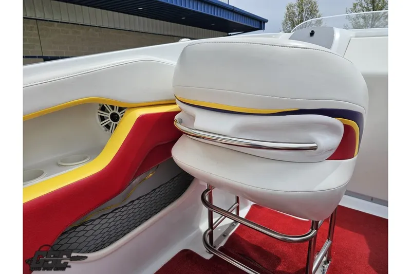 Slide: The Image of Interior of 2005 Baja 30 Outlaw boat with colorful seating and speaker detail. - 52