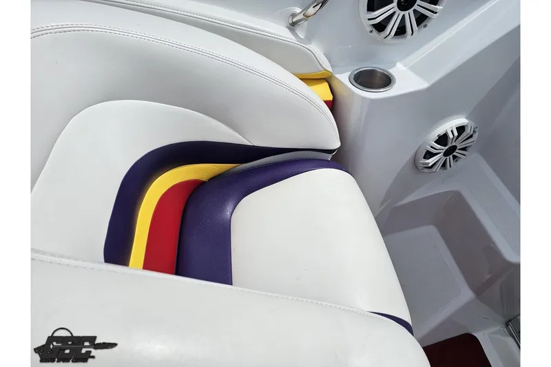 Slide: The Image of Interior of a 2005 Baja 30 Outlaw boat with colorful seat accents and speakers. - 55