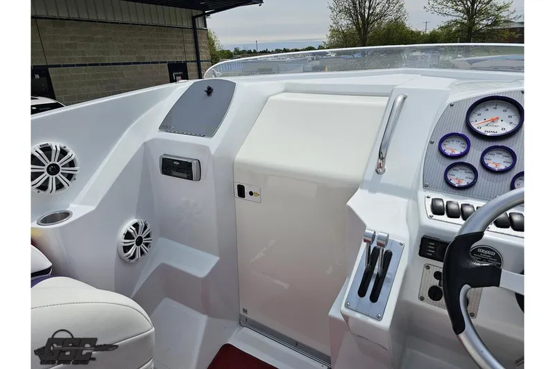Slide: The Image of 2005 Baja 30 Outlaw boat dashboard with gauges and controls. - 60
