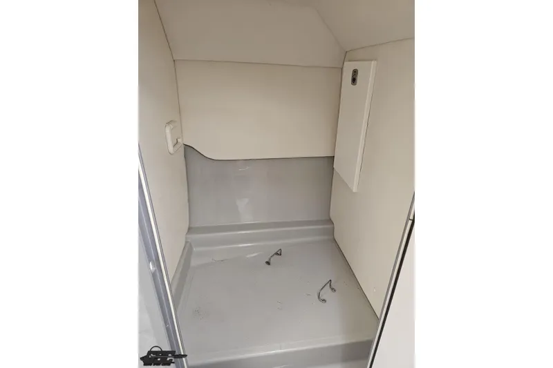 Slide: The Image of 2005 Baja 30 Outlaw interior cabin space, featuring clean, minimalist design. - 75