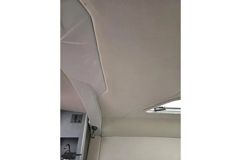 Slide: The Image of Interior view of a 2005 Baja 30 Outlaw boat cabin ceiling and wall. - 76