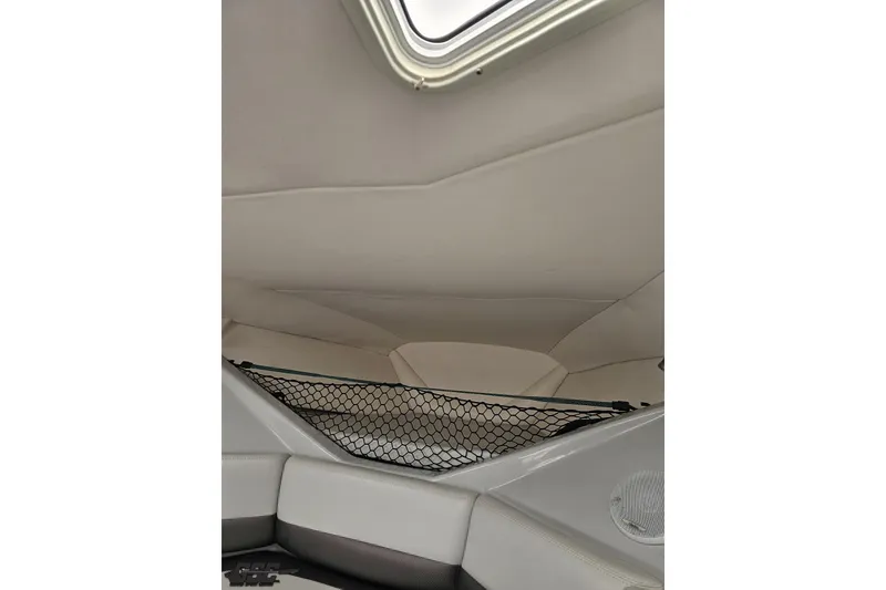 Slide: The Image of Interior cabin of a 2005 Baja 30 Outlaw boat with net storage. - 77