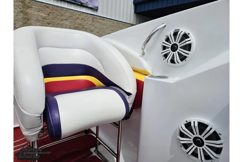 Slide: The Image of 2005 Baja 30 Outlaw boat interior with colorful seat and marine speakers. - 79