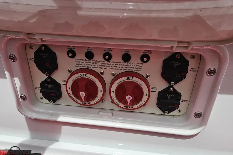 Slide: The Image of Control panel of a 2005 Baja 30 Outlaw boat with battery switches and circuit breakers. - 84