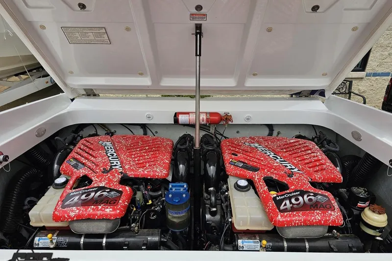Slide: The Image of 2005 Baja 30 Outlaw boat engine compartment with twin MerCruiser 496 MAG engines. - 86