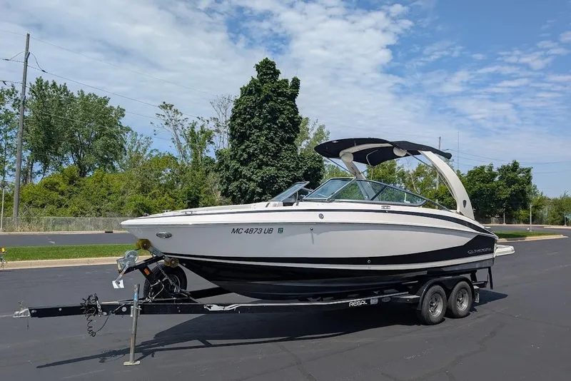 The Image of 2017 Regal 2500 Bowrider boat on trailer, parked outdoors under a clear sky. - 0