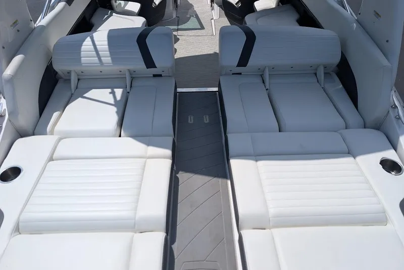 Slide: The Image of 2017 Regal 2500 Bowrider boat interior with white cushioned seating. - 10