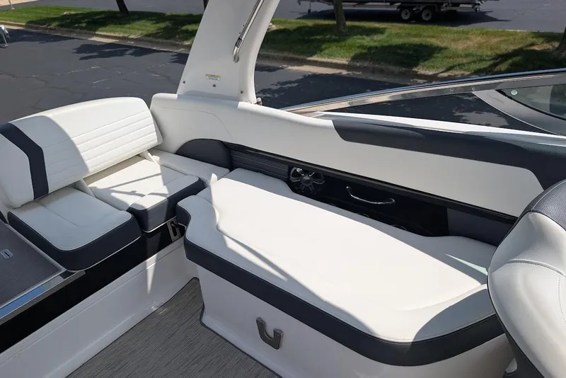 Slide: The Image of 2017 Regal 2500 Bowrider interior with white and black seating, showcasing luxury design. - 14