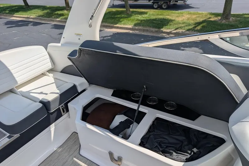 Slide: The Image of 2017 Regal 2500 Bowrider interior with open storage compartment and seating. - 15