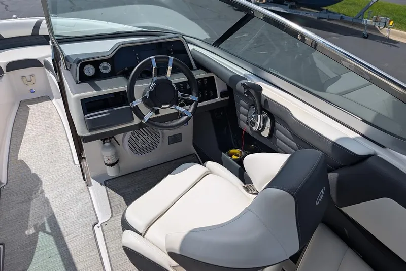 Slide: The Image of Cockpit of 2017 Regal 2500 Bowrider with steering wheel and control panel. - 16