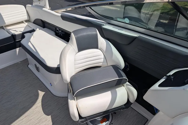 Slide: The Image of Interior of a 2017 Regal 2500 Bowrider boat with white and black seating. - 22