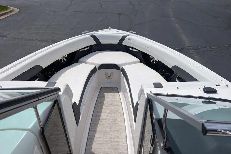 Slide: The Image of 2017 Regal 2500 Bowrider interior with white seating and open deck view. - 27