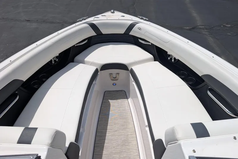 Slide: The Image of 2017 Regal 2500 Bowrider boat interior with white seating and cup holders. - 28