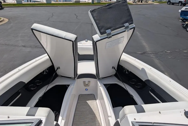 Slide: The Image of 2017 Regal 2500 Bowrider boat interior with open storage compartments. - 29