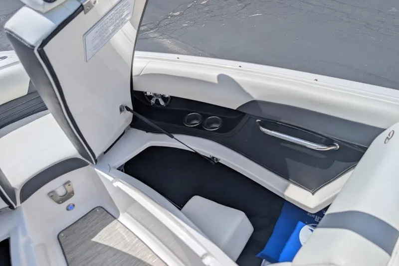 Slide: The Image of 2017 Regal 2500 Bowrider interior with open storage compartment and seating. - 30