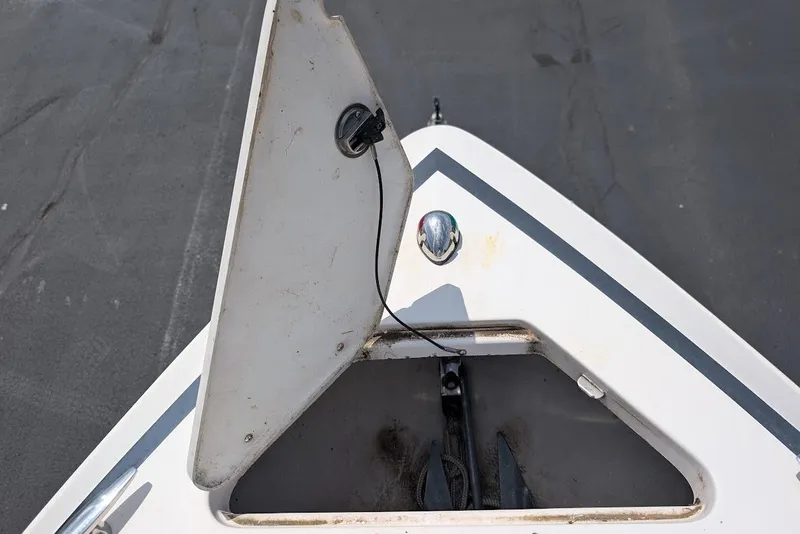Slide: The Image of Open anchor compartment on 2017 Regal 2500 Bowrider boat, showing anchor storage. - 32