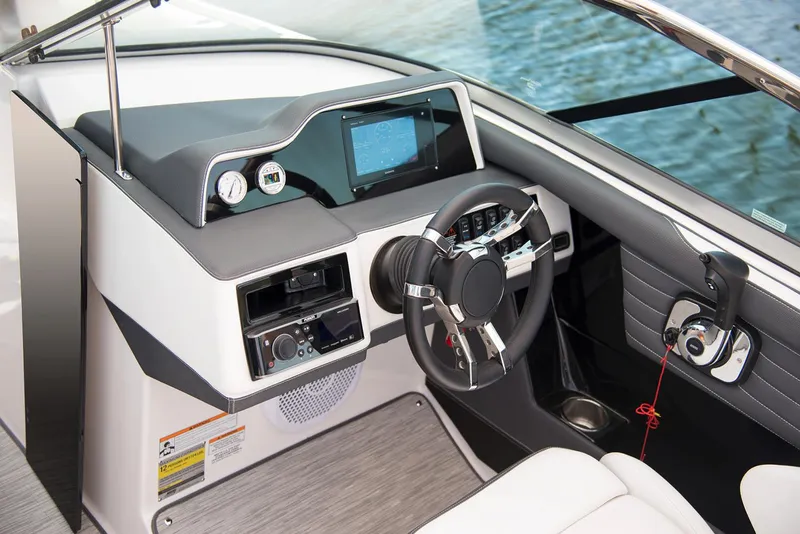 Slide: The Image of Manufacturer Provided Image: 2017 Regal 2500 Bowrider boat dashboard with steering wheel and control panel. - 44