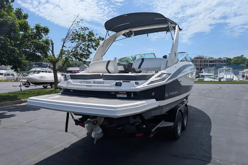 Slide: The Image of 2017 Regal 2500 Bowrider boat on trailer in marina parking lot. - 6