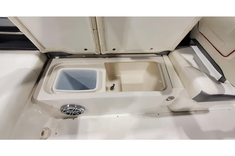 Slide: The Image of 2018 Formula 270 Sun Sport boat interior with storage compartments and speaker. - 10