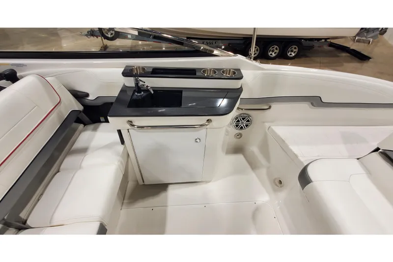 Slide: The Image of 2018 Formula 270 Sun Sport boat interior with seating and kitchenette area. - 12