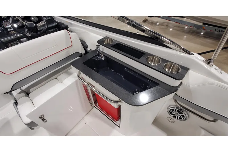 Slide: The Image of 2018 Formula 270 Sun Sport boat interior with sink, cup holders, and seating. - 14