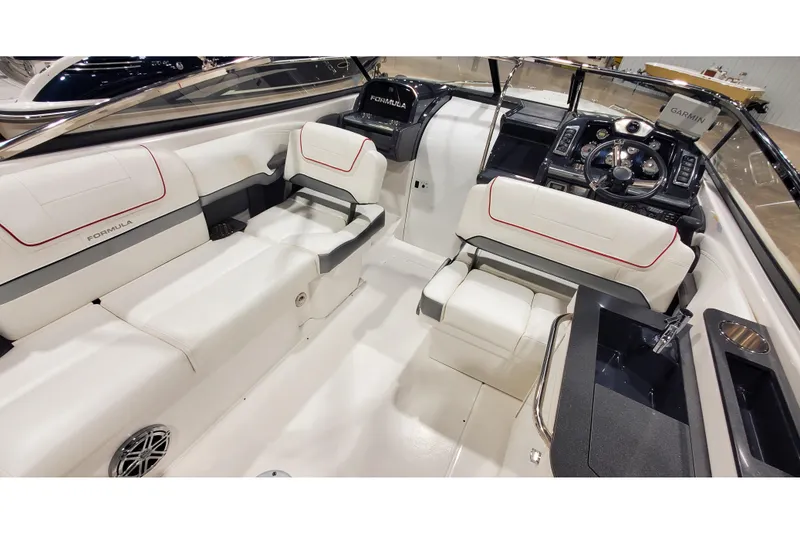 Slide: The Image of Interior of 2018 Formula 270 Sun Sport boat with white seating and modern dashboard. - 16