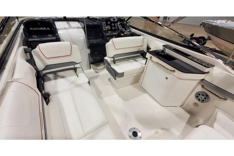Slide: The Image of Interior of 2018 Formula 270 Sun Sport boat with white seating and compact kitchenette. - 17