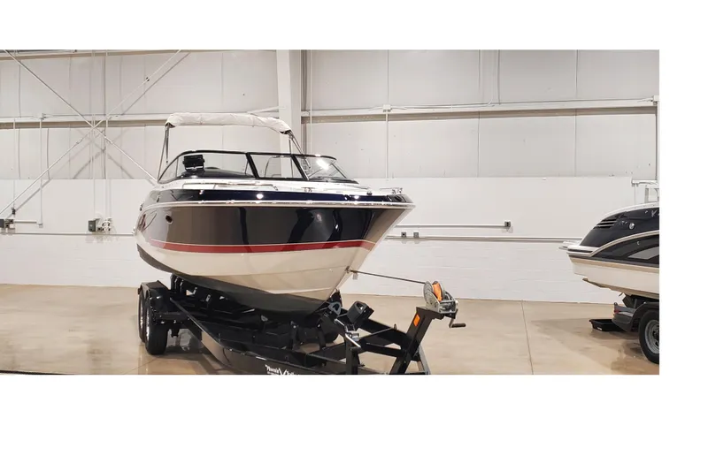 Slide: The Image of 2018 Formula 270 Sun Sport boat on trailer in indoor showroom. - 2