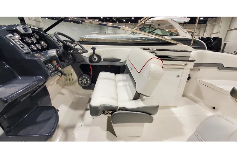 Slide: The Image of Interior of a 2018 Formula 270 Sun Sport boat with white seating and control panel. - 20