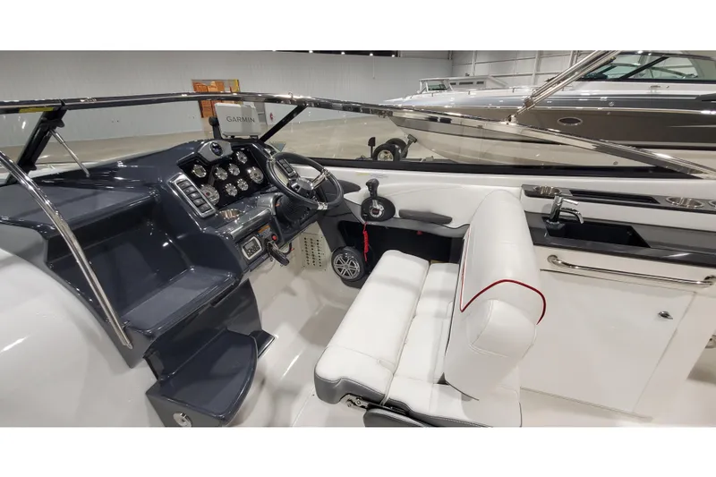 Slide: The Image of 2018 Formula 270 Sun Sport boat interior with steering wheel and dashboard controls. - 21