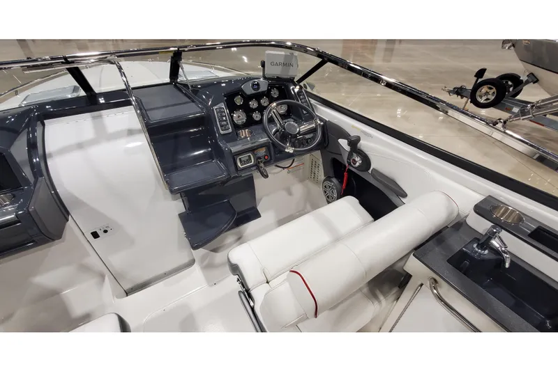 Slide: The Image of 2018 Formula 270 Sun Sport boat cockpit with steering wheel and control panel. - 22