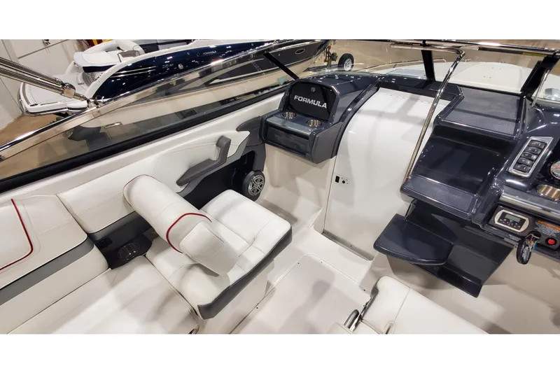 Slide: The Image of Interior of 2018 Formula 270 Sun Sport boat with white seating and modern dashboard. - 23