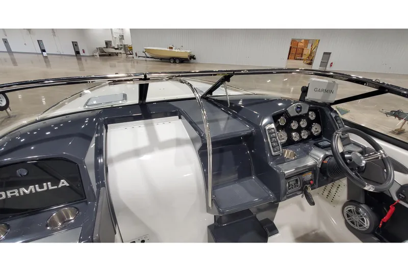 Slide: The Image of 2018 Formula 270 Sun Sport boat dashboard with Garmin navigation system and steering wheel. - 24