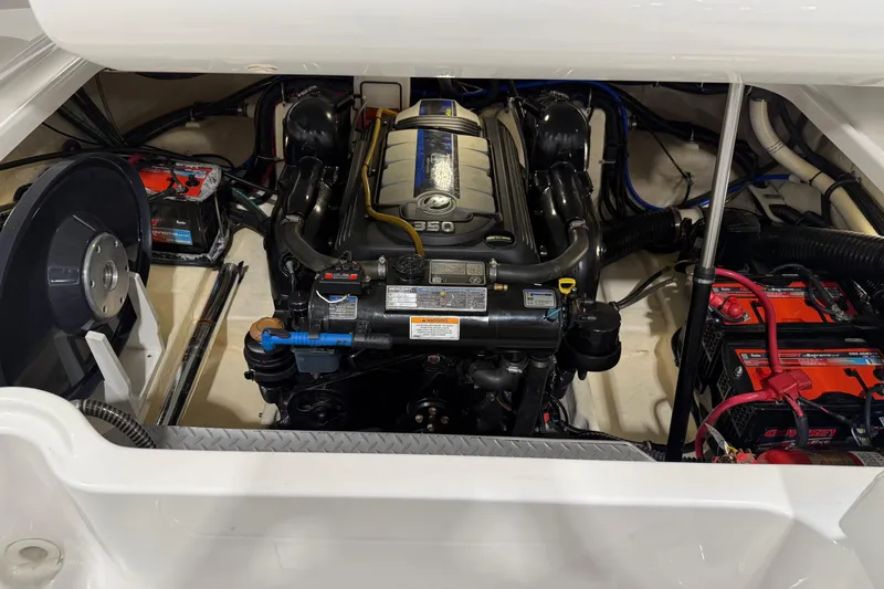 Slide: The Image of Engine compartment of a 2018 Formula 270 Sun Sport boat, showcasing the powerful motor. - 25