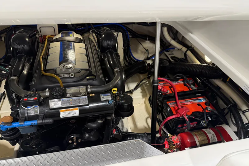 Slide: The Image of Engine compartment of a 2018 Formula 270 Sun Sport boat, featuring a 350 horsepower engine. - 26