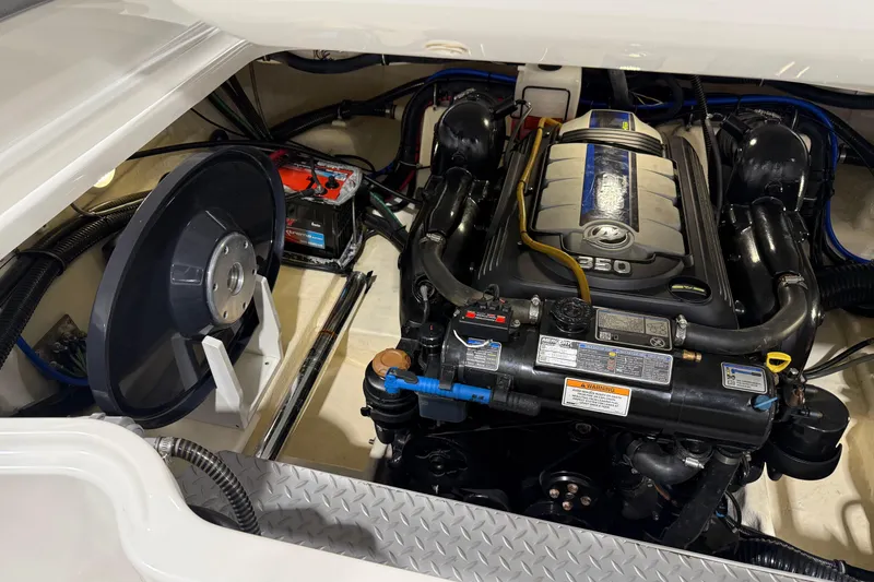 Slide: The Image of Engine compartment of a 2018 Formula 270 Sun Sport boat, featuring a powerful engine. - 27