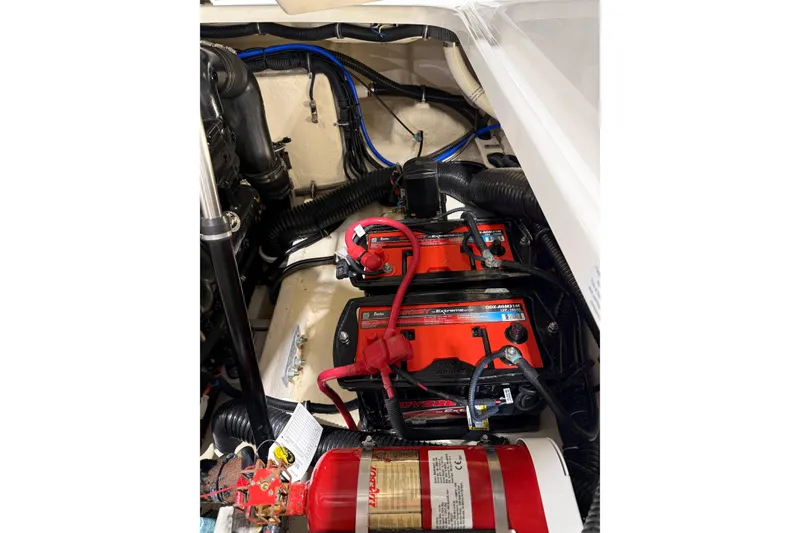 Slide: The Image of Engine compartment of a 2018 Formula 270 Sun Sport with batteries and fire extinguisher. - 28