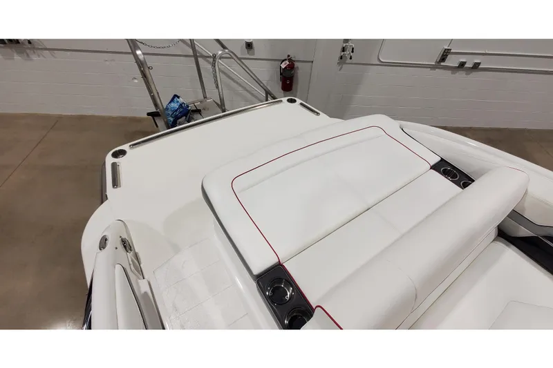 Slide: The Image of 2018 Formula 270 Sun Sport boat interior with white seating and red accents. - 6