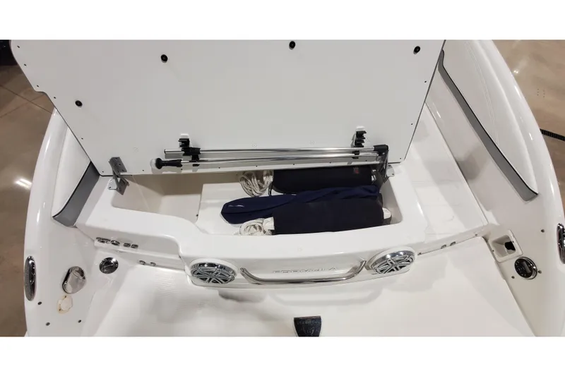 Slide: The Image of 2018 Formula 270 Sun Sport boat storage compartment with open hatch and speakers. - 7