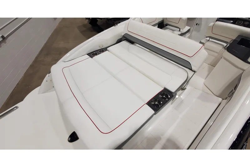 Slide: The Image of 2018 Formula 270 Sun Sport boat interior with white seating and cup holders. - 8