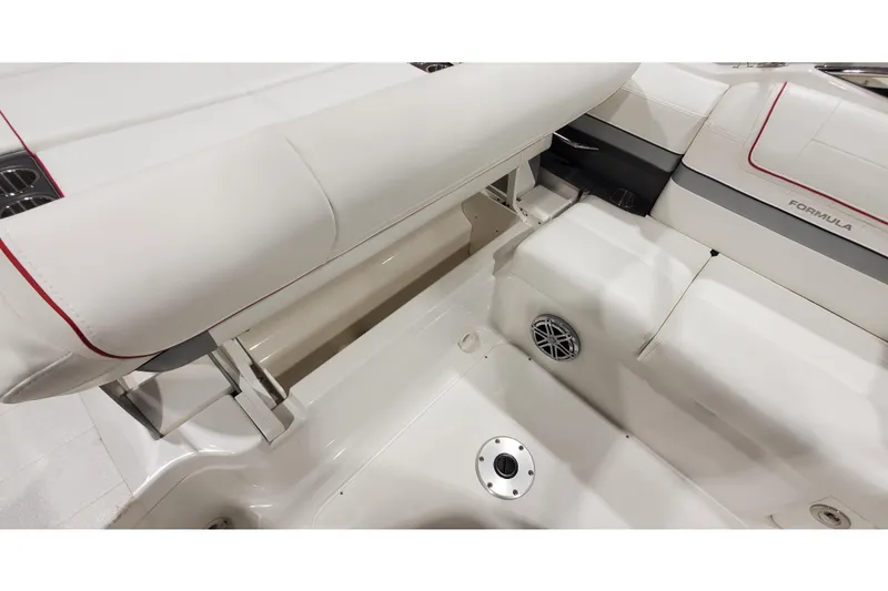 Slide: The Image of Interior seating of 2018 Formula 270 Sun Sport boat, featuring white upholstery and speaker. - 9