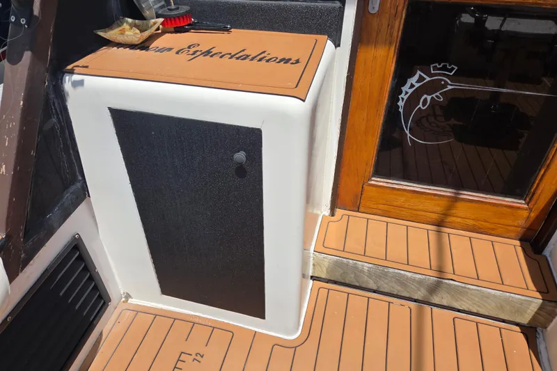 Slide: The Image of 1990 Egg Harbor Golden Egg 42 boat interior with wooden accents and nautical decor. - 11