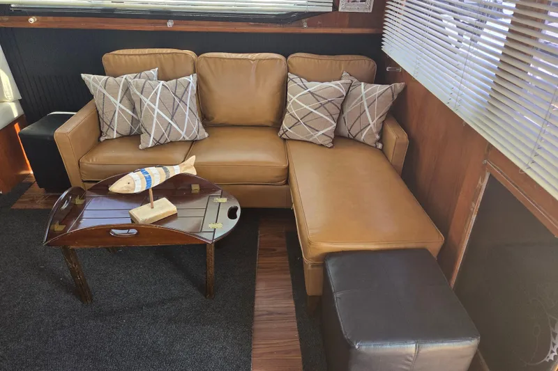 Slide: The Image of Luxurious interior of 1990 Egg Harbor Golden Egg 42 yacht with leather sofa and decorative pillows. - 15