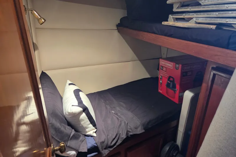Slide: The Image of Cozy cabin interior of 1990 Egg Harbor Golden Egg 42 yacht with bed and storage. - 17