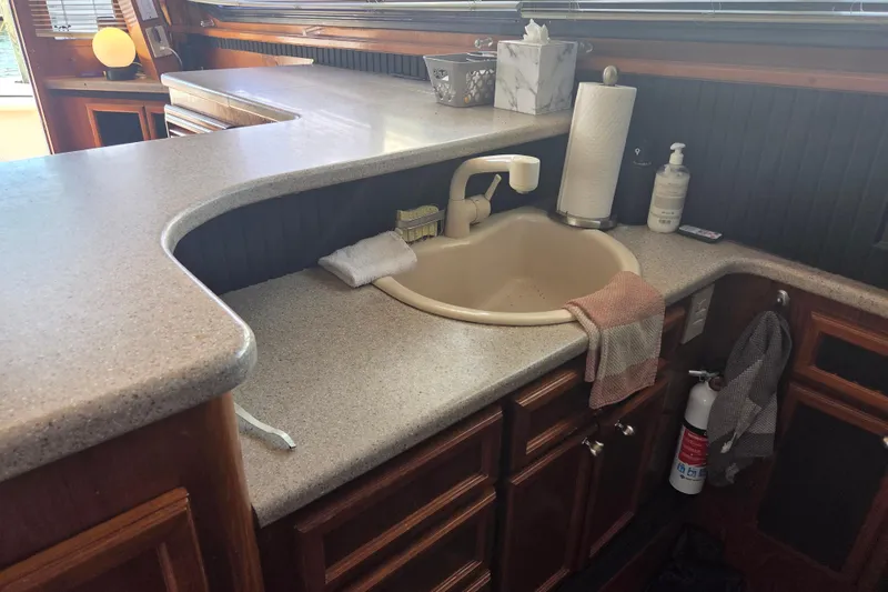 Slide: The Image of Interior of 1990 Egg Harbor Golden Egg 42 yacht with kitchen sink and countertop. - 23