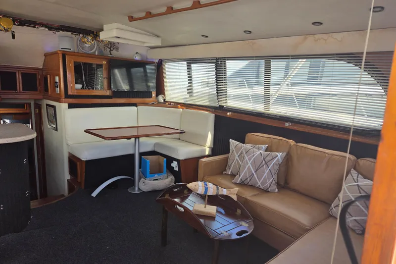 Slide: The Image of Interior of 1990 Egg Harbor Golden Egg 42 yacht with cozy seating and dining area. - 26